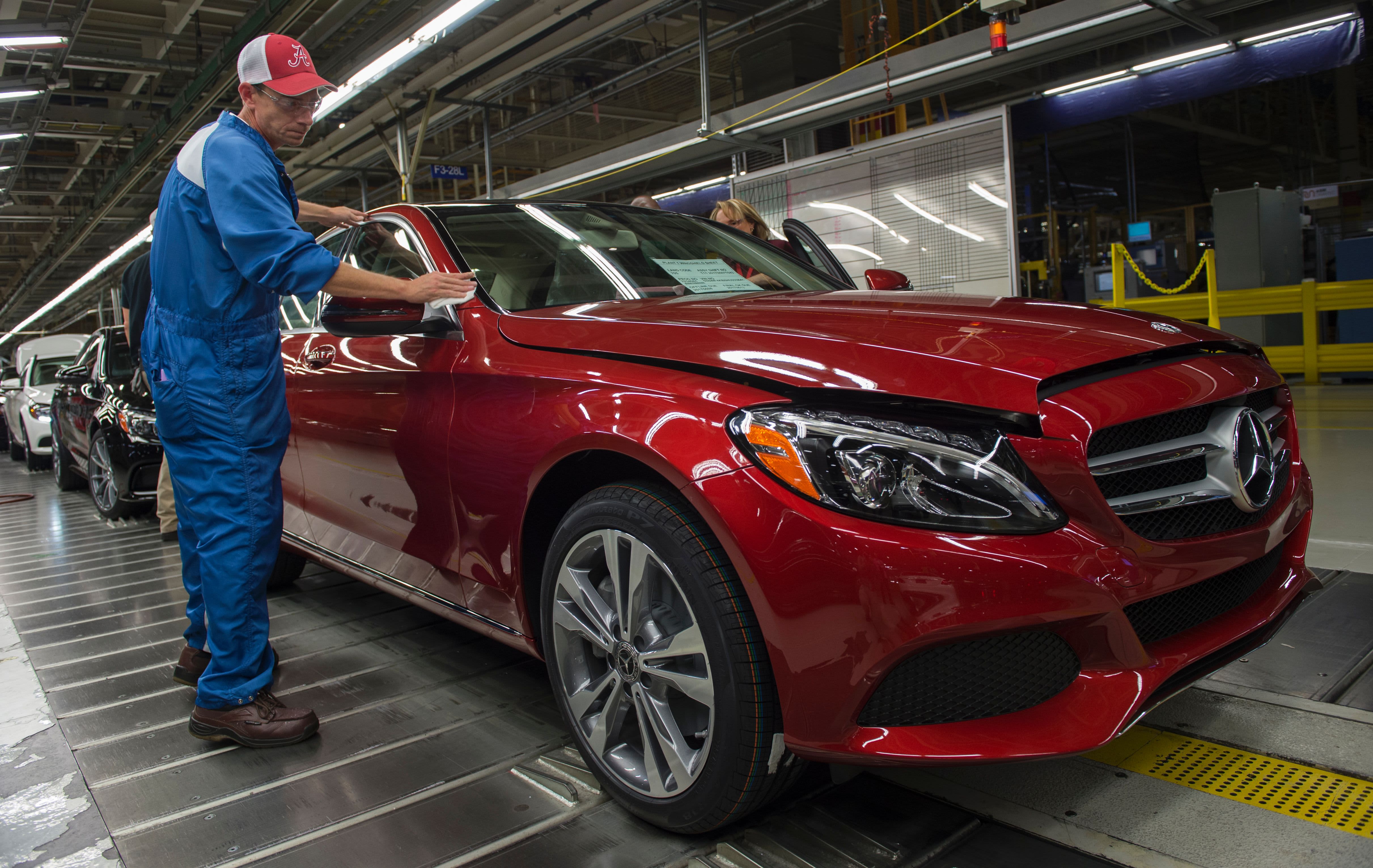 An employee does final inspections on a Mercedes-Benz C-Class at the Mercedes-Benz US International factory in Vance, Alabama.